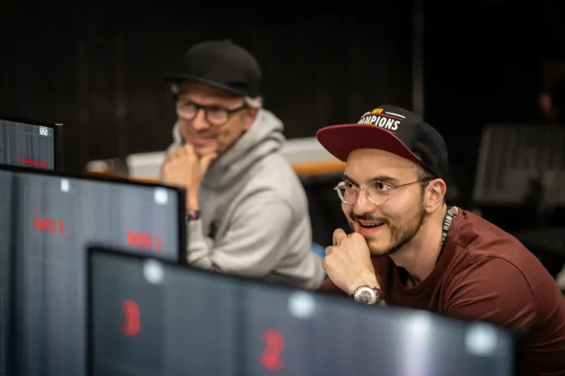 Two men working on creating the object detection orchestra