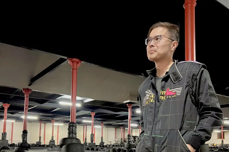 Peter Chiu posing in a go-kart jacket 