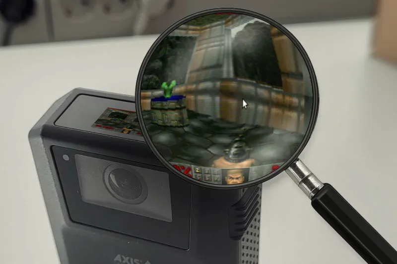 Image of body worn and a magnifying glass showing Doom