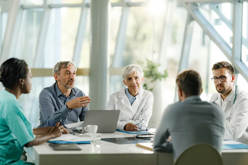 Healthcare professionals meeting in a conference room