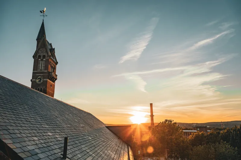 Aerial of Chicopee, MA at sunset with clock tower