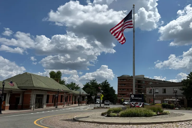 Rutherford, NJ sign, flag pole, train station