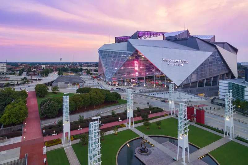 Aerial of Mercedes Benz Stadium with pink sky