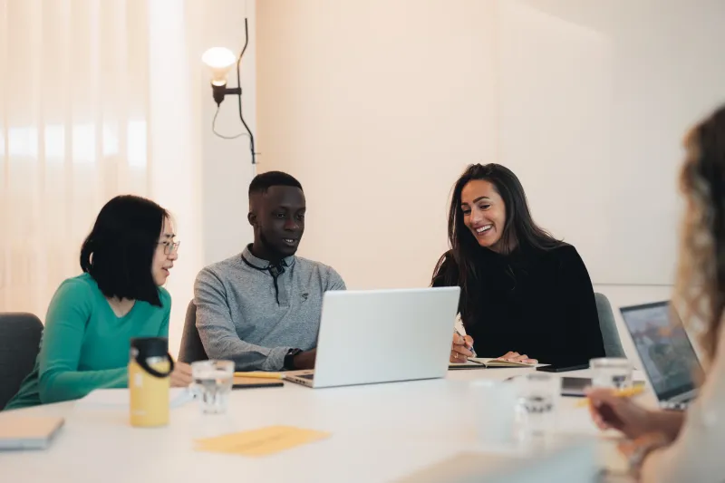Axis colleagues having a meeting in a conference room.