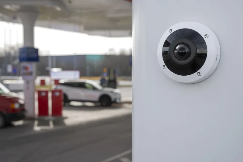 AXIS M4348-PLVE Panoramic Camera mounted on wall in front of a gas station