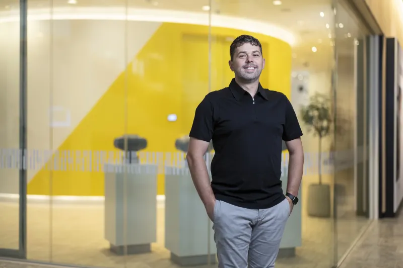 Markus Prebble, software engineer at Axis, standing outside Axis Experience Center in Lund, smiling.