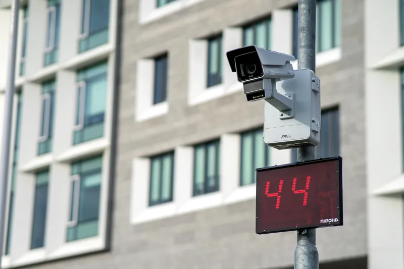 AXIS Radar Integration with AXIS Q1656 DLE mounted on a pole. The radar sign is showing a speed of 44.