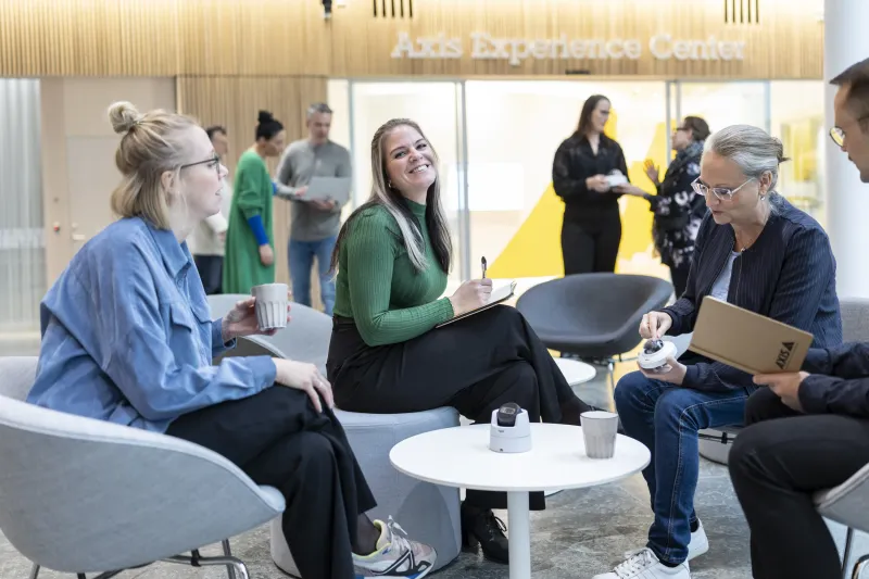 Colleagues at Axis having a casual meeting at the Axis office.