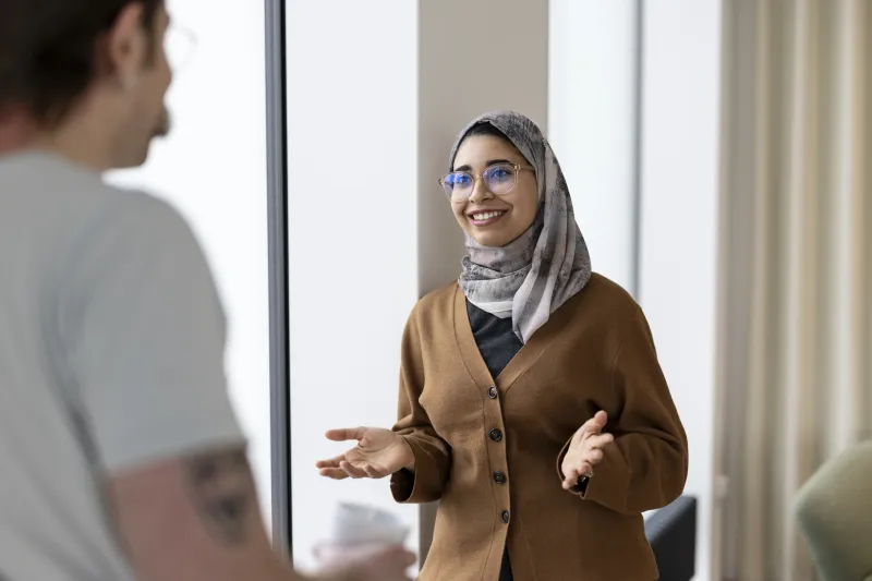 Woman is talking to a colleague 