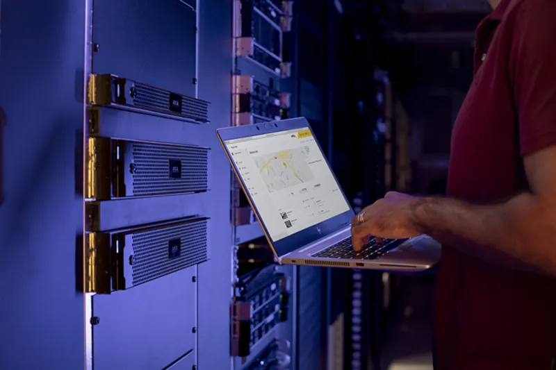 Servers and technician with laptop