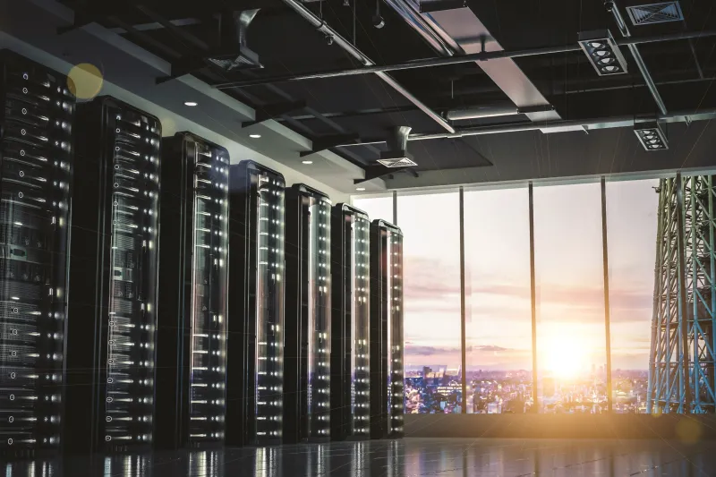 Servers and window with cityscape sunset