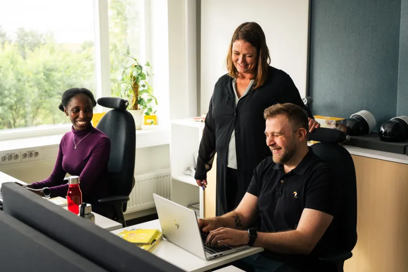 Axis colleagues in an office environment