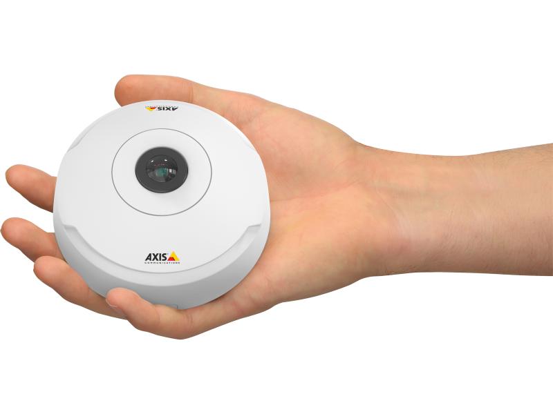 Human hand holding round camera.