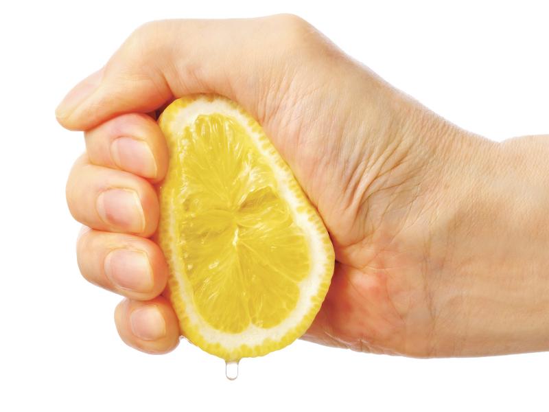 Hand that's squeezing a lemon
