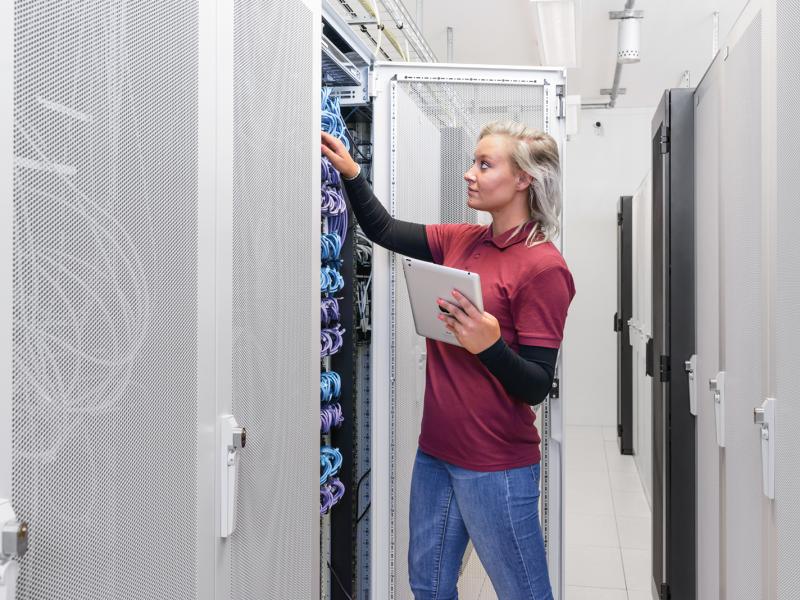Female technician checking the rack