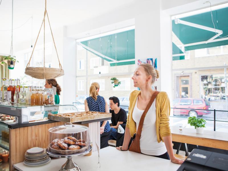 Female customer at a bakery in daylight