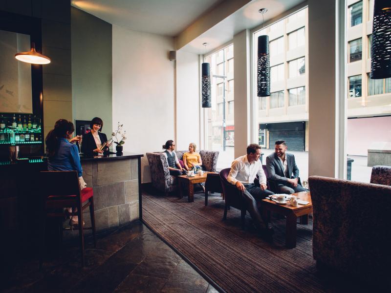 People socializing in a hotel bar