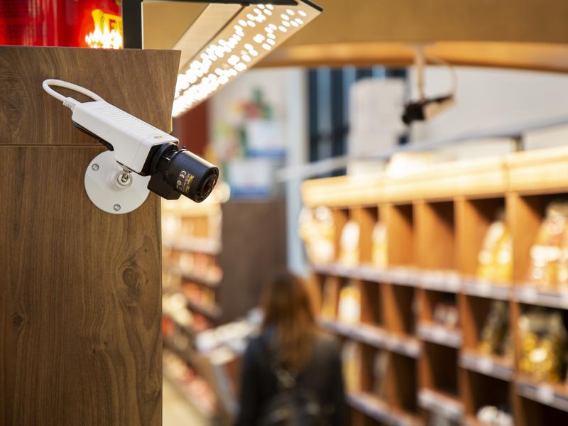 Network camera mounted on a shelf in a convenience store