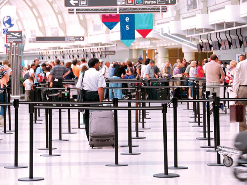 Passengers queues at check-in on airport