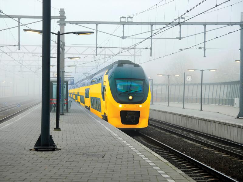  Axis camera subway with yellow train stnading at a platform