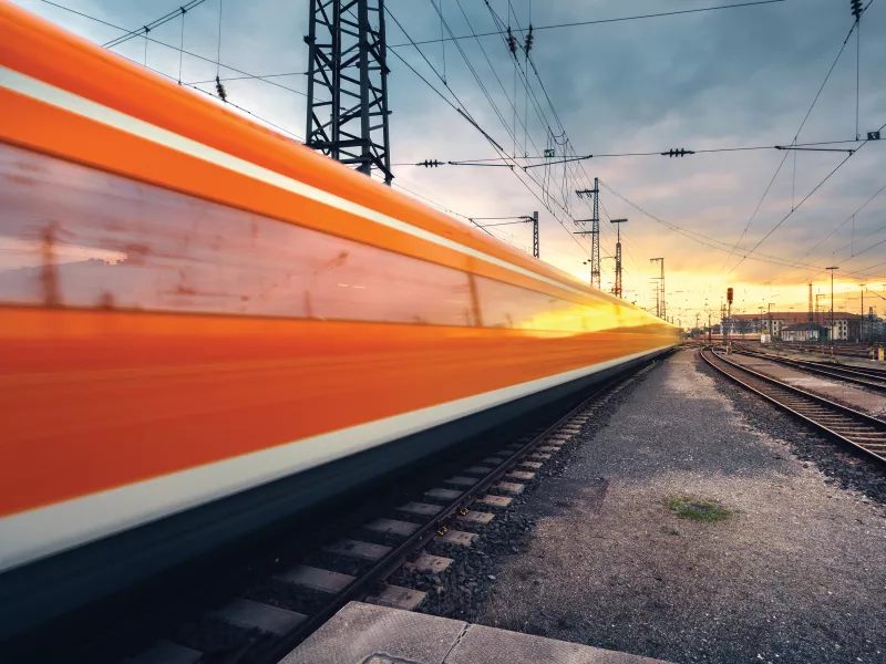 Railroad train in the sunset