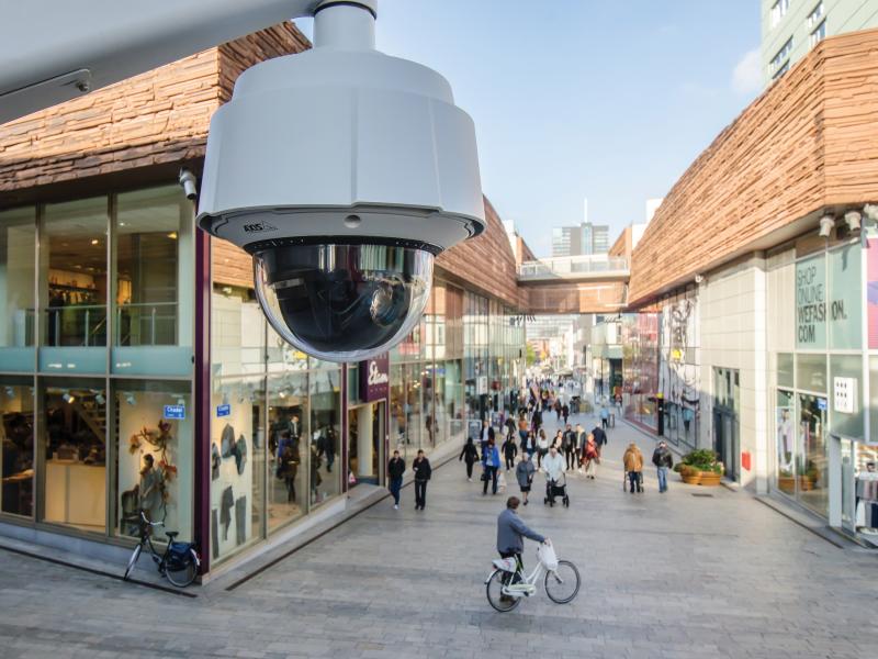 Closeup of Axis Q60 camera at shopping street intersection.