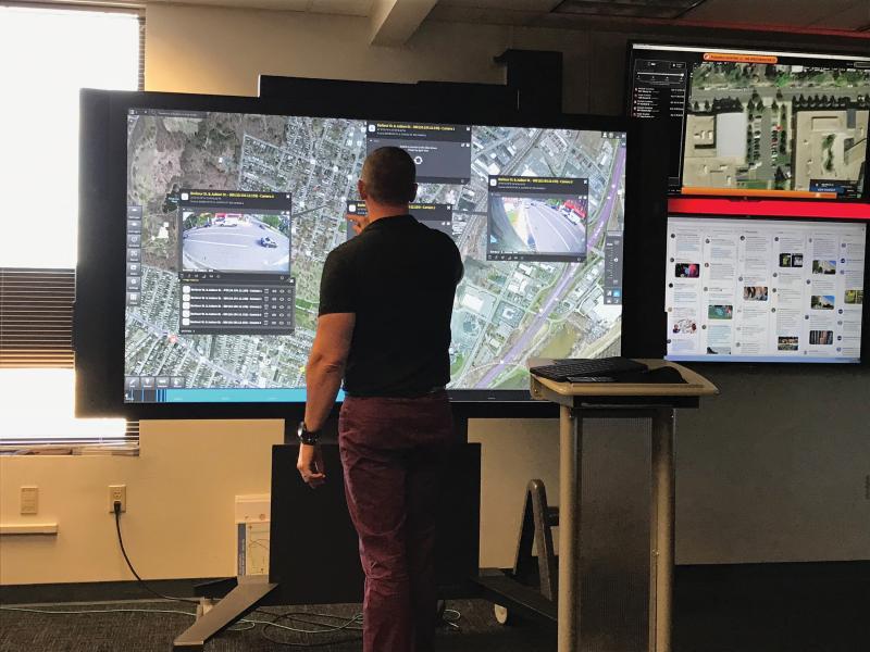 Man viewing monitor screen of Live Earth.