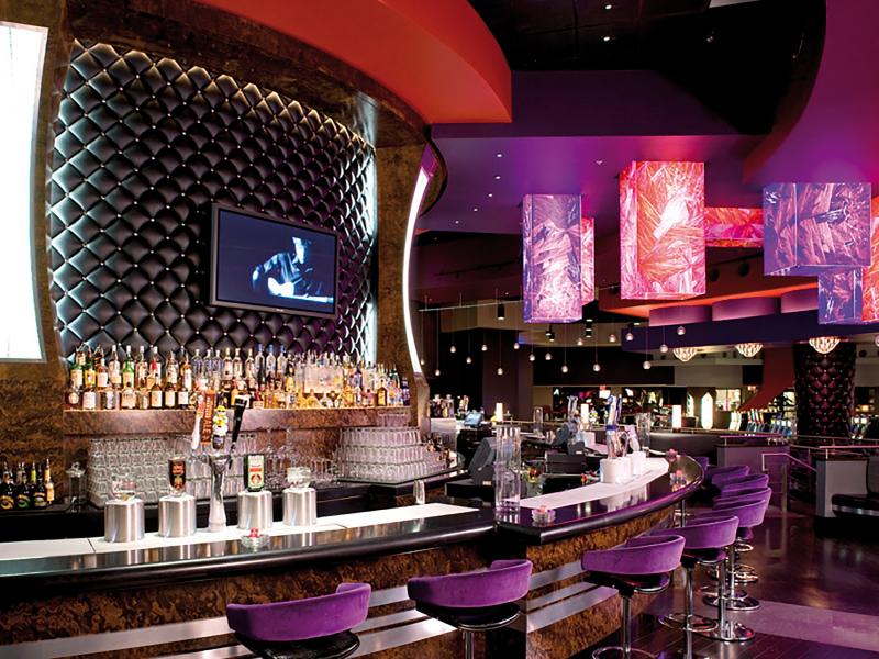 Hard rock cafe empty bar with purple light.