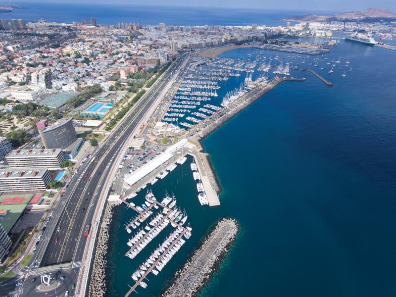 Las palmas harbour viewed from sky, dark blue water surrounding.