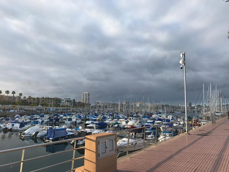 Boats in harbour and a pole camera.