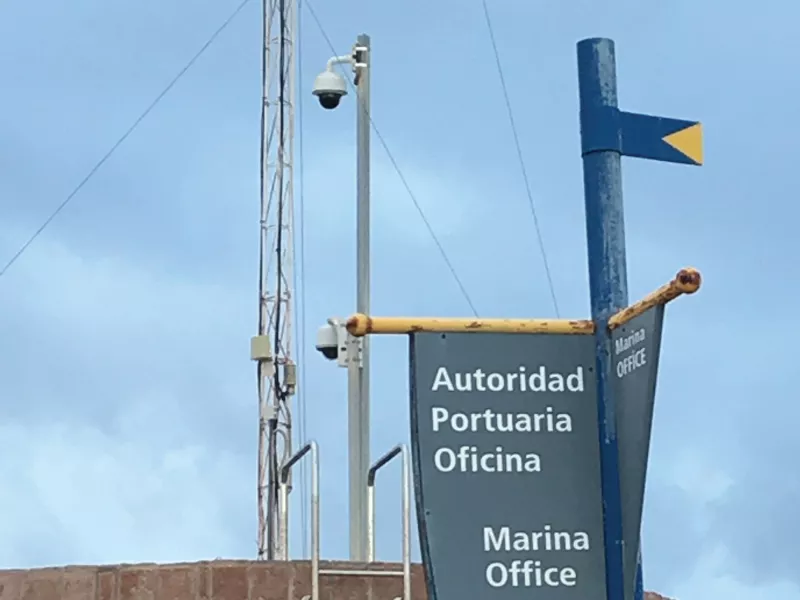 Pole camera and sign of marine office.