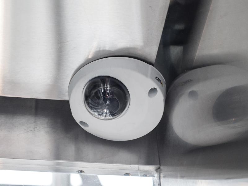 Axis P3915-R Network Camera in a corner in the ceiling.