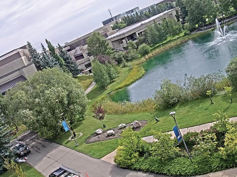 Mount royal university with garden and fountain, viewed from above.