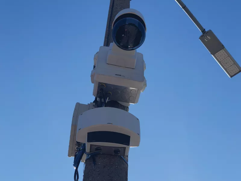 Axis Q6125-LE and D2050-VE on pole, viewed from below.