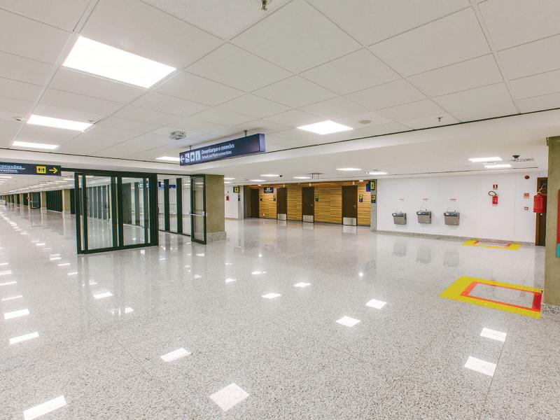 Airport exit from inside with focus on lightning.