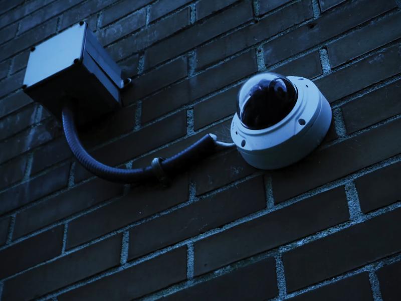 Closeup on Axis Camera attached to wall of Rock Hill School.