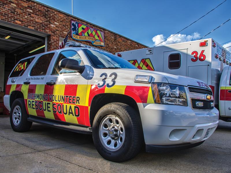 Richmond rescue squad car viewed from its right angle, ambulance in background.