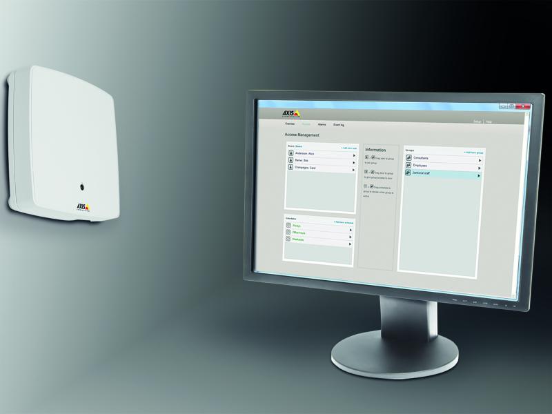 A1001 mounted on a wall, computer screen that standing beside.