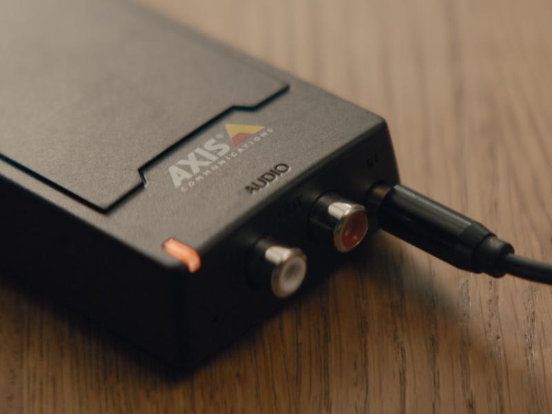 AXIS C8033 Audio Bridge laying on a table
