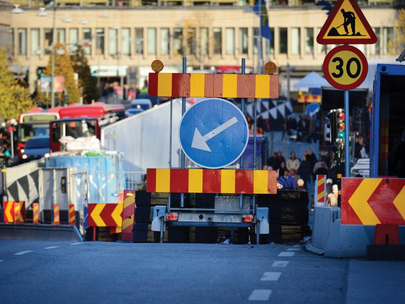 Roadwork with barriers sign