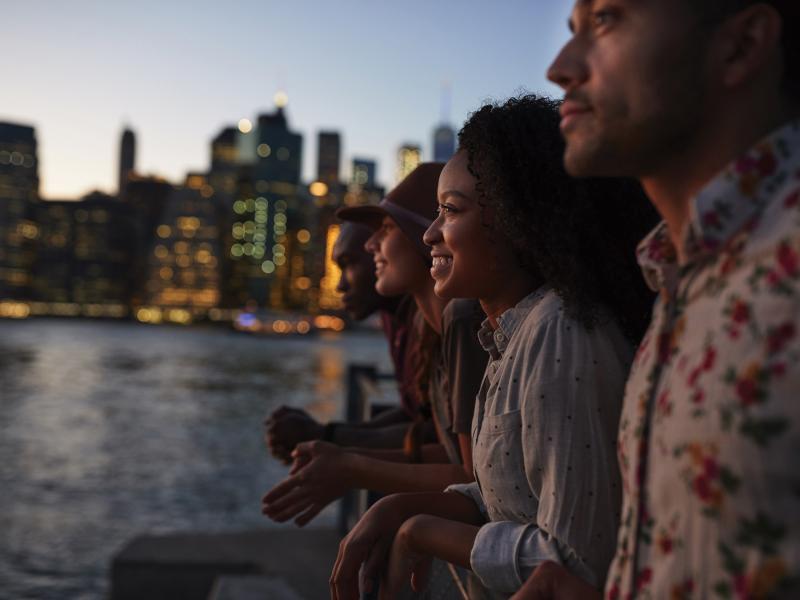 A group of young people looking over water