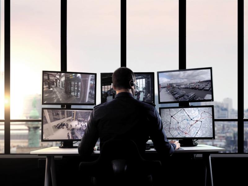 Man monitors several traffic screens