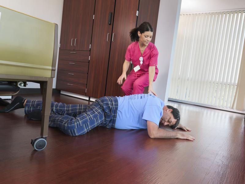 Nurse helping fallen man