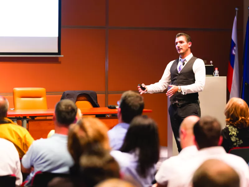 Man speaking in front of audience