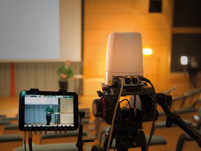 Closeup of a camera that record auditorium