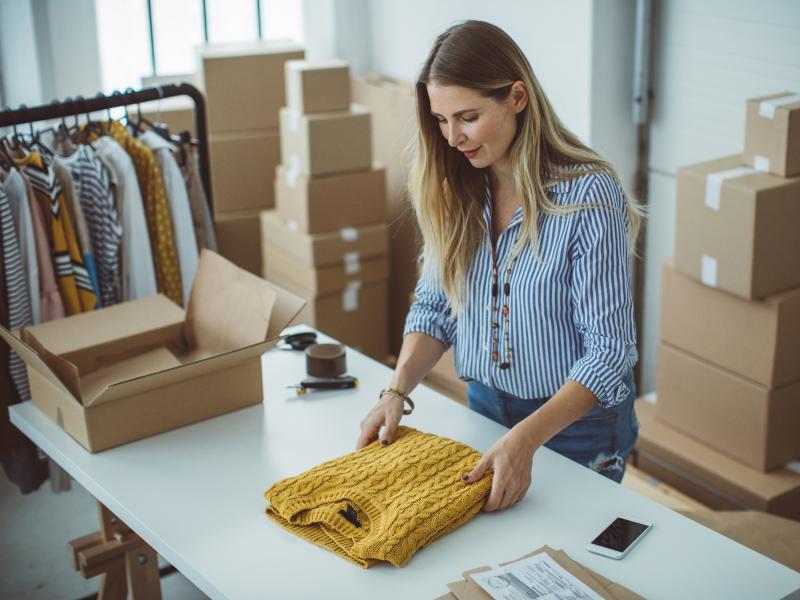 Woman packing yellow sweater