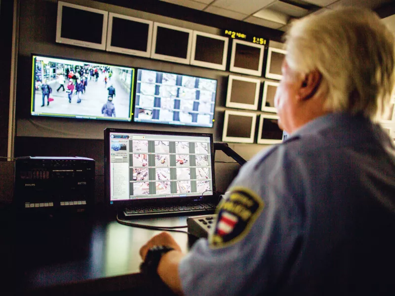 Man looking at monitors