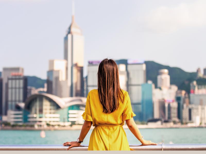 Woman looking out over a city