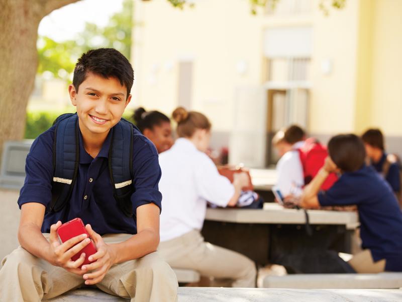 High school student with a phone