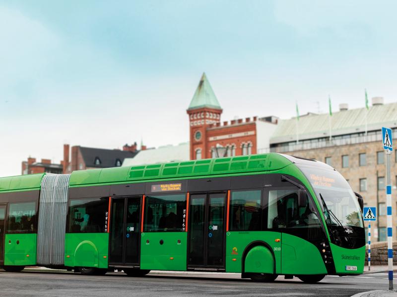 Green bus passing by